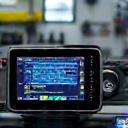 A modern vehicle diagnostic machine in a workshop.